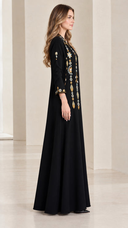 Side profile of black embroidered floor-length dress