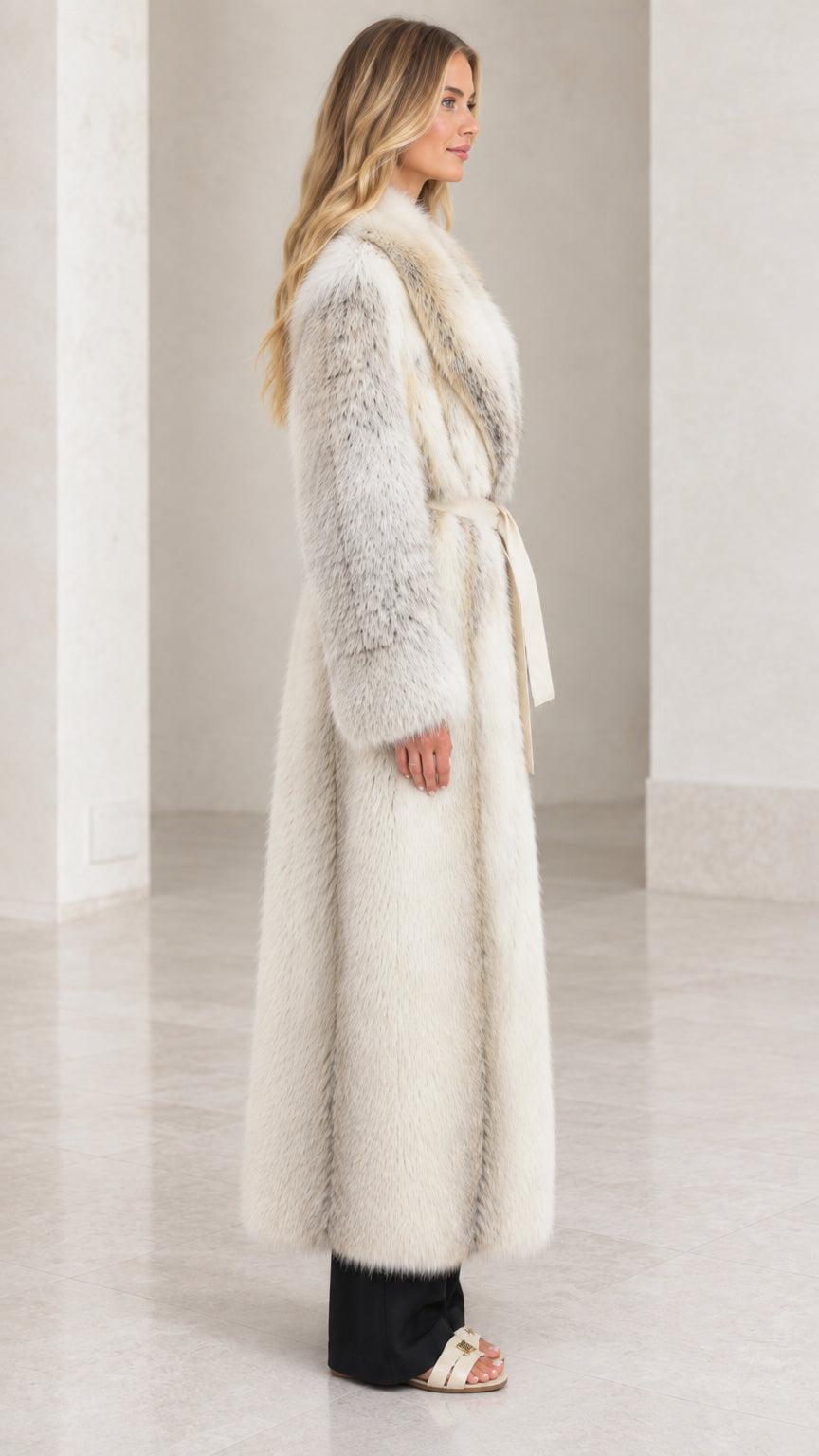 Side full-length view of woman in Ivory Frost long faux fur coat
