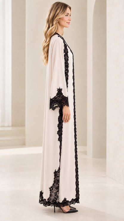 Side full-length view of cream lace trim long sleeve abaya dress
