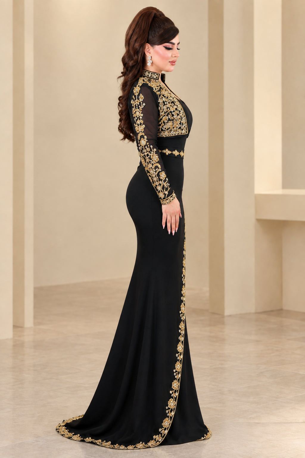 Side profile of woman wearing black floor-length embroidered evening dress