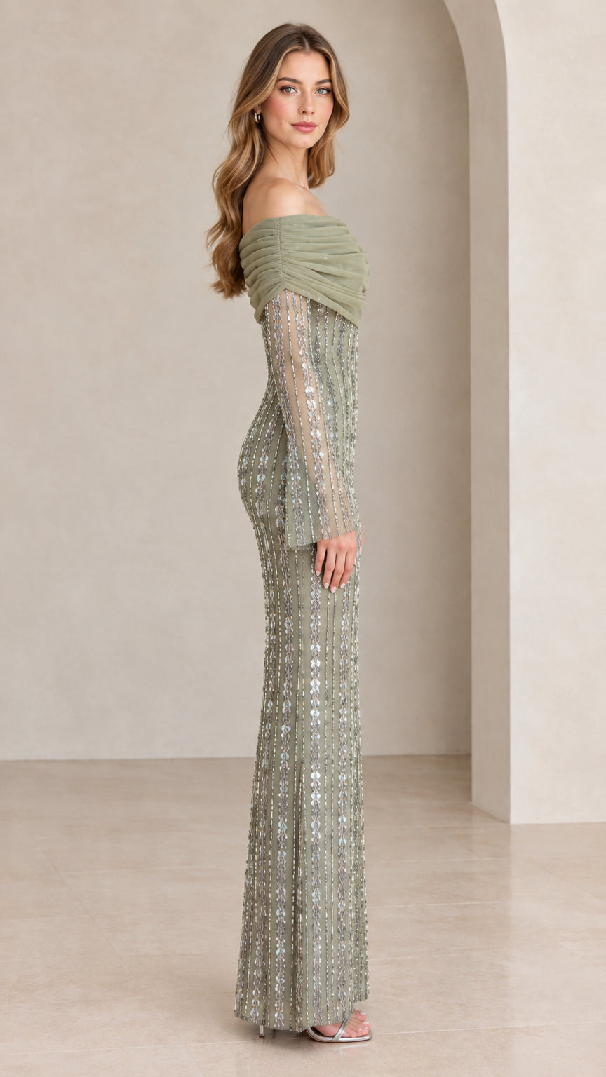 Side profile of model in Sage Green draped sequin column maxi dress