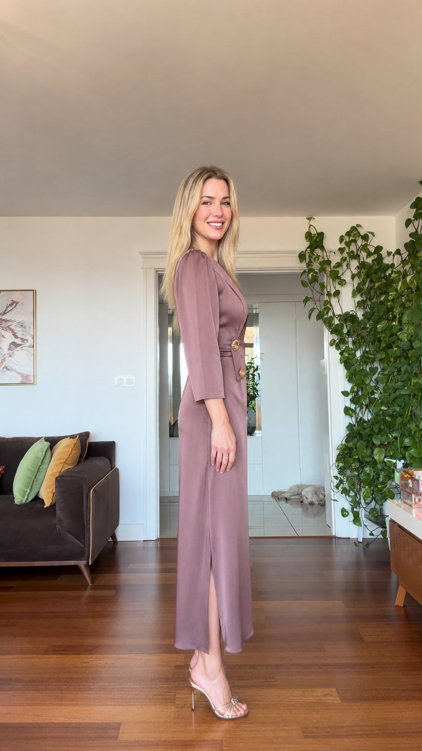 Side angle view of model in dusty mauve satin maxi dress showing side slit