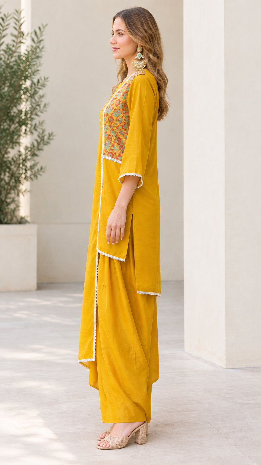 Side profile view of Mustard Yellow draped tunic and dhoti pant outfit