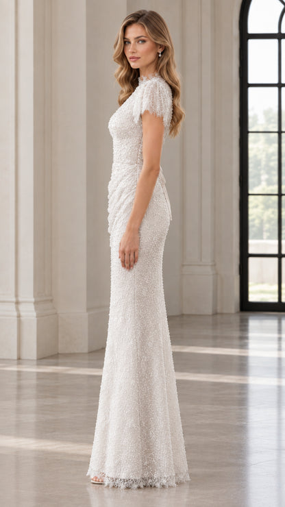 Side profile of model in white beaded sequin maxi dress showing elegant column fit