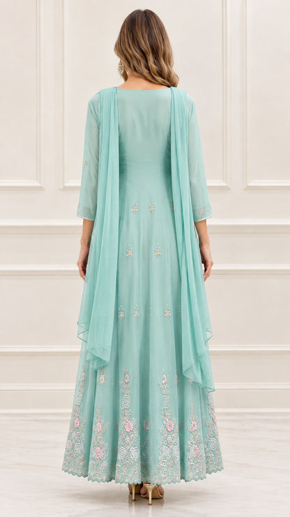 Back view of mint green scoop back maxi dress with drape scarf