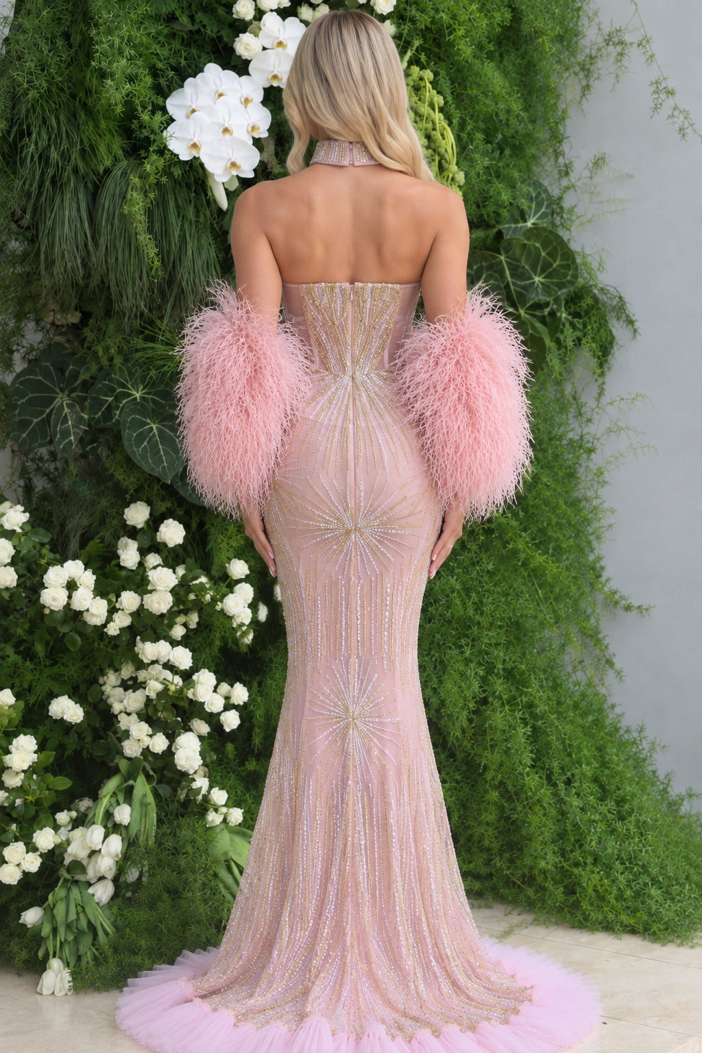 Back view of blush pink mermaid gown showing train and structured corset back