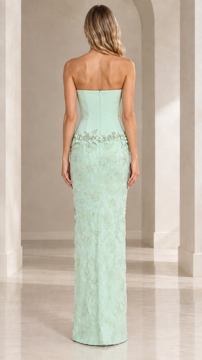 Back view of mint green formal evening gown with fitted back silhouette
