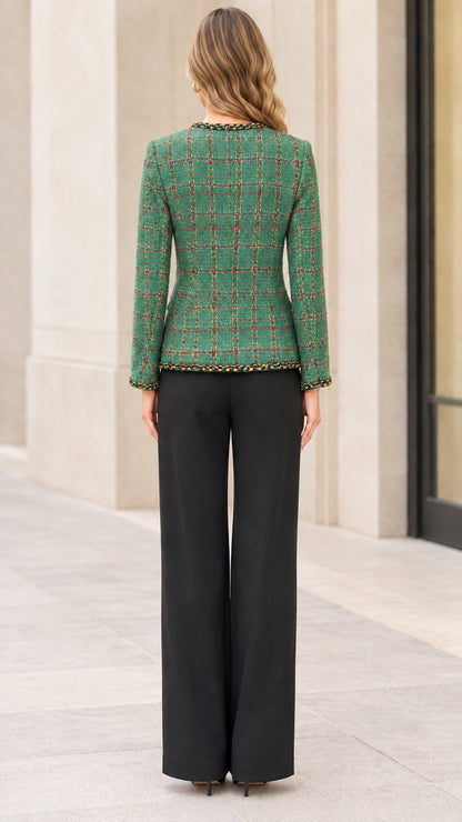 Back view of a woman wearing a green plaid tweed jacket