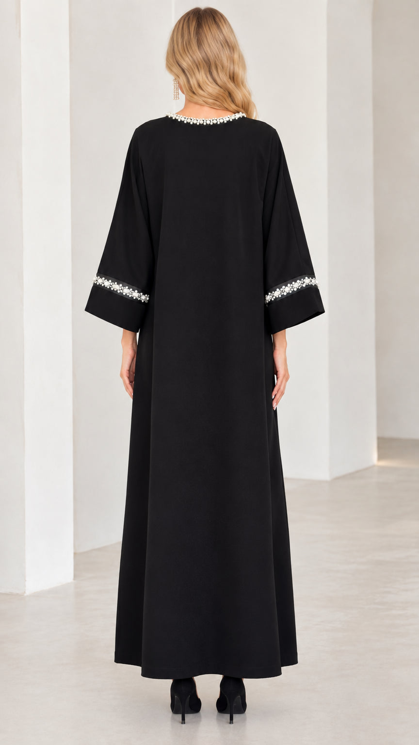 Back view of woman wearing full length black modest maxi gown