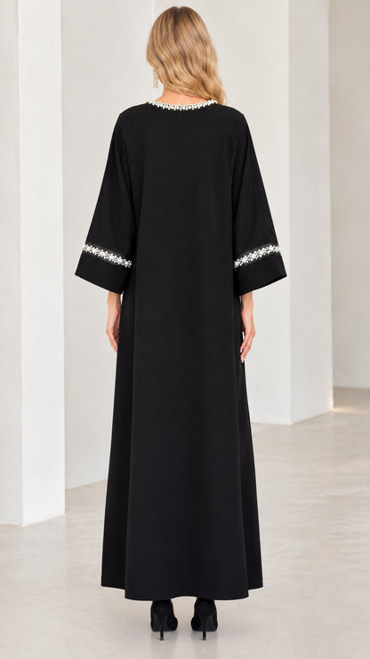 Back view of woman wearing full length black modest maxi gown
