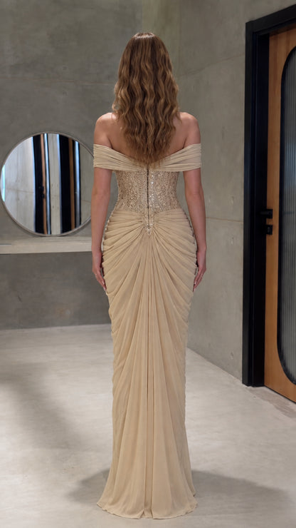 Back view of floor-length champagne formal gown with gathered detailing