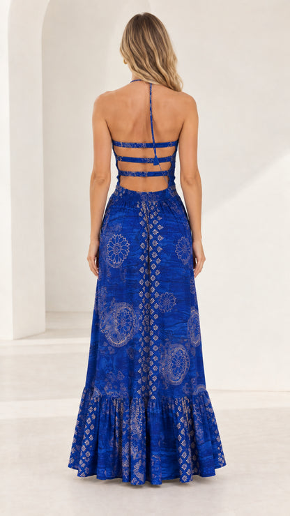 Back full-length view showing multi-strap open back detail on royal blue maxi dress