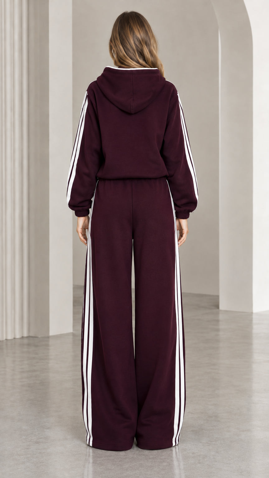 Back view of burgundy hooded sweatshirt and matching wide leg sweatpants