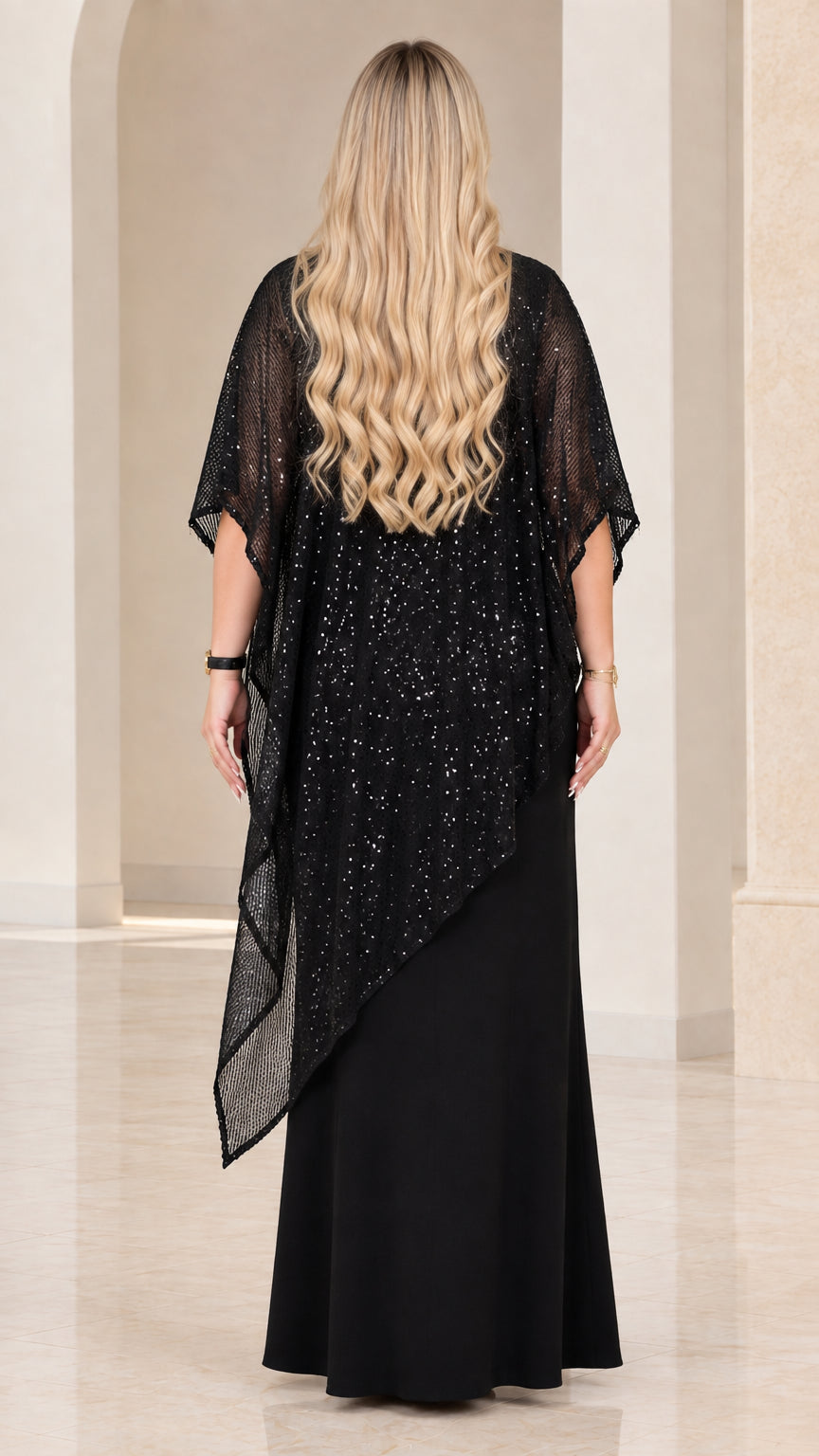 Back view of model wearing Black sequin drape maxi gown