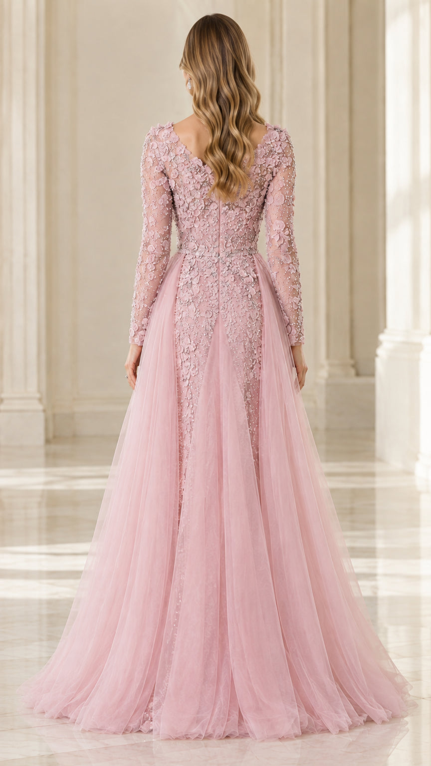 Back view of dusty pink long sleeve formal gown with sweeping tulle skirt