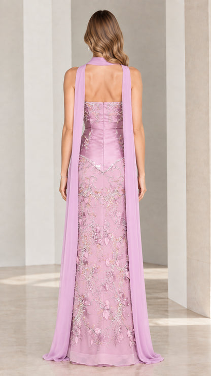 Back view of model in lilac column evening gown showing strapless back and trailing chiffon drape