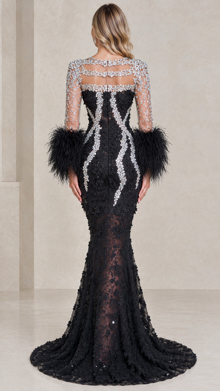 Back view of black mermaid gown with crystal details and feather sleeves