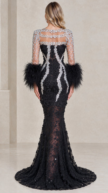 Back view of black mermaid gown with crystal details and feather sleeves