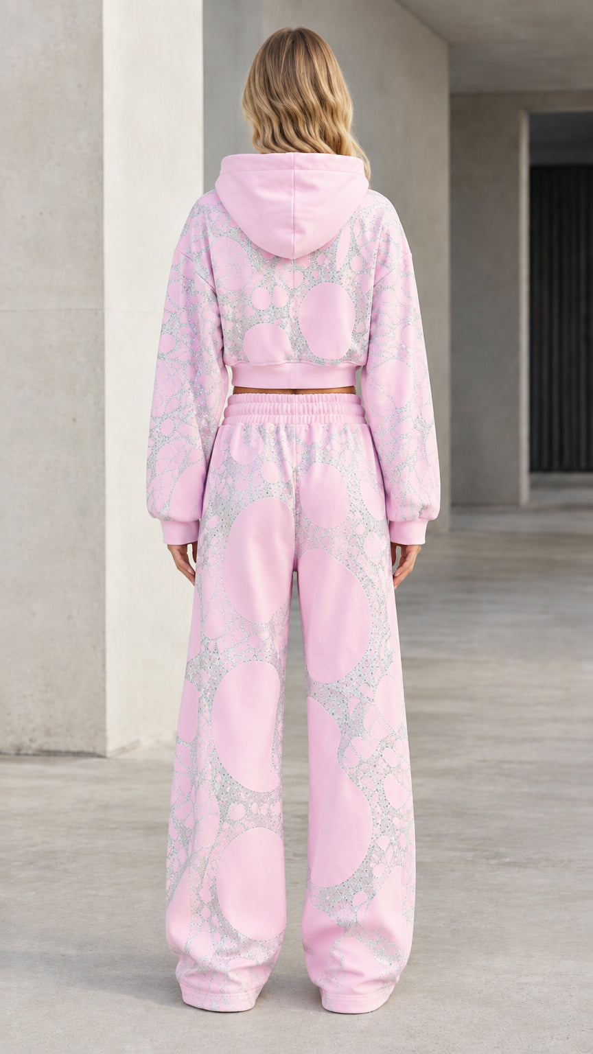 Back view of model in pink hooded cropped sweatshirt and wide-leg loungewear pants