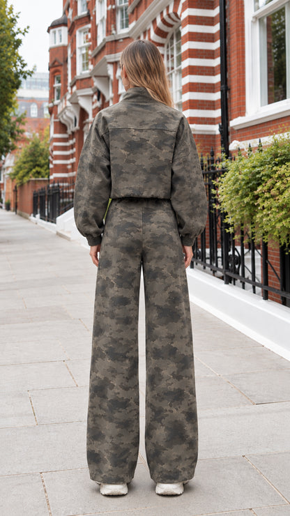Back view of dark olive camo cropped jacket and relaxed wide-leg trousers