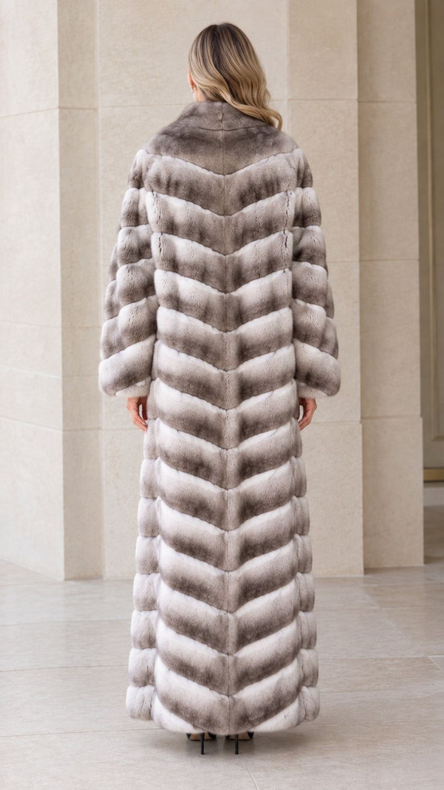Back view of woman wearing chevron textured grey ombre maxi faux fur coat