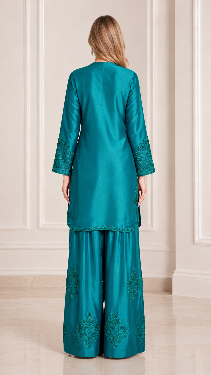 Teal satin two piece suit back view showing flowing silhouette