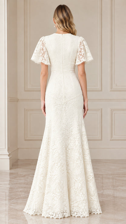 Back view of woman wearing elegant ivory lace mermaid dress with back zipper
