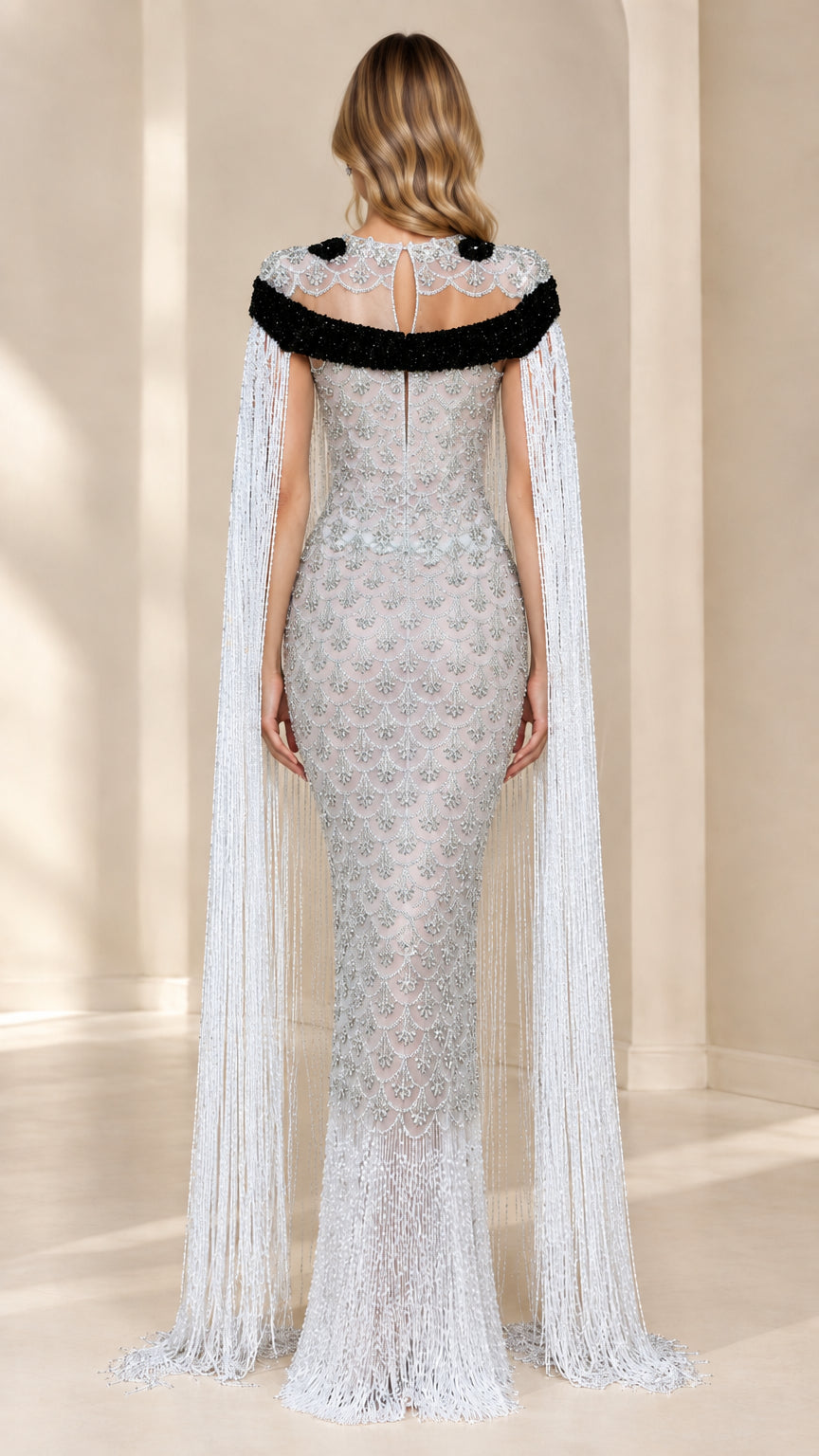 Back view of Silver Illusion Neckline Gown with Beaded Cape