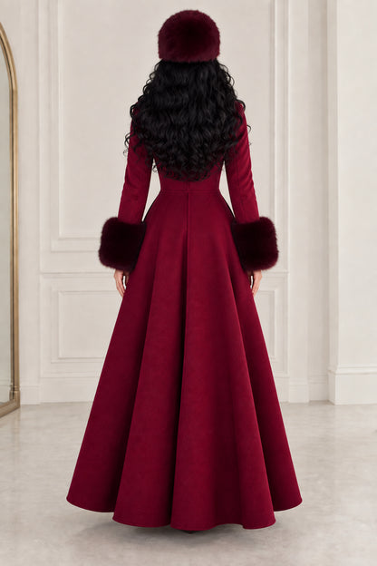 Back view of sweeping flared silhouette of burgundy winter maxi coat