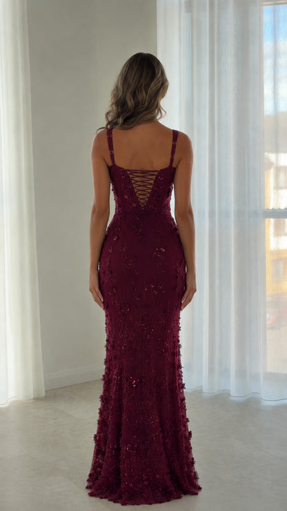 Back view of burgundy formal dress showcasing the lace-up corset back design