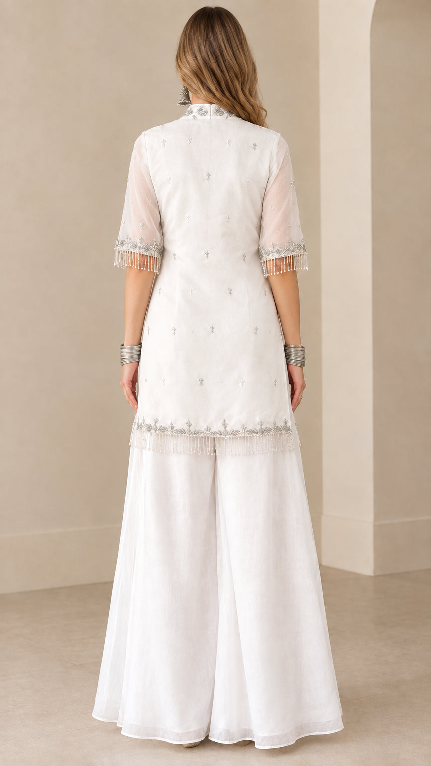 Back view of white embroidered kurti sharara suit set