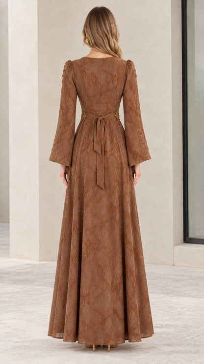 Back view of brown jacquard maxi dress showing back tie and zipper closure