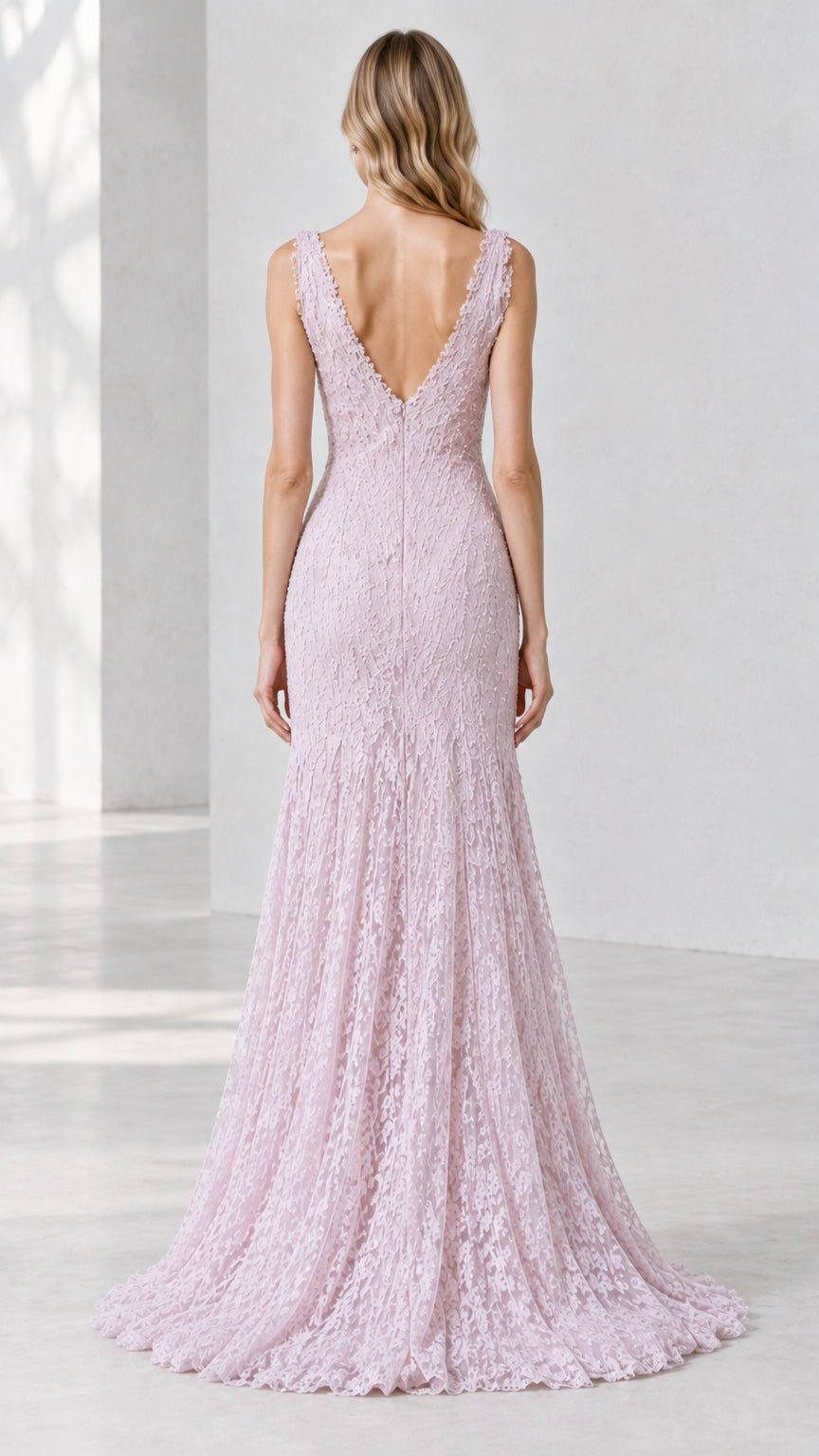 Back view of lilac lace gown showing deep V-back design