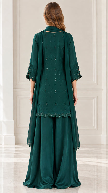 Back view of emerald green embroidered tunic and flowing palazzo trousers