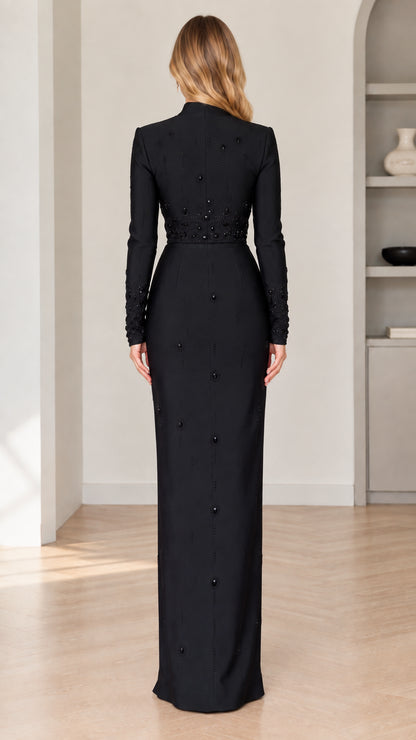 Back view of model in elegant black floor-length formal dress