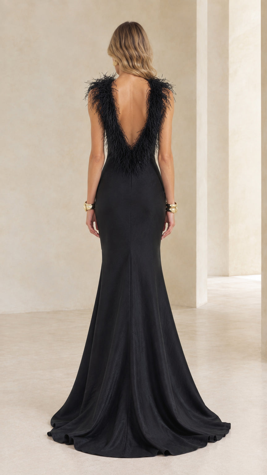 Black mermaid evening dress showing deep V-back with feather trim and train