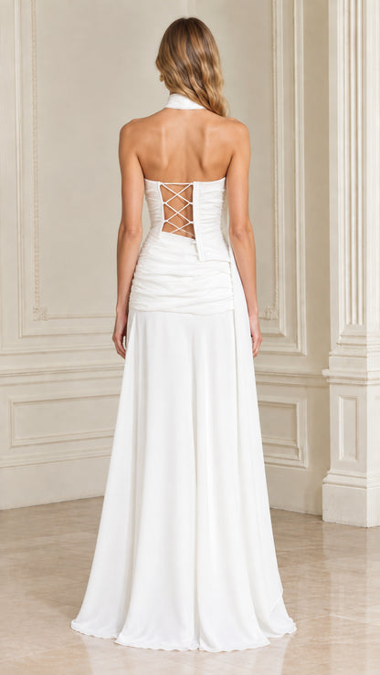 Back view of white formal gown showcasing lace-up corset back detail