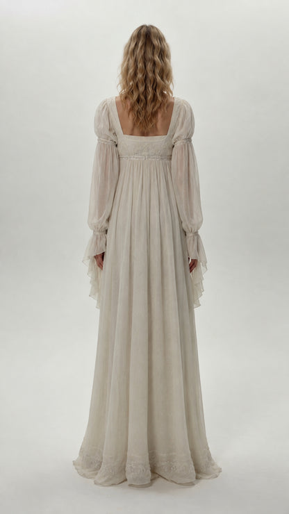 Back view of model wearing ivory square neck chiffon maxi gown