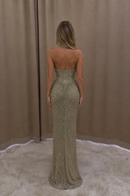 Back view of Champagne Gold halter neck evening gown with ruched detail