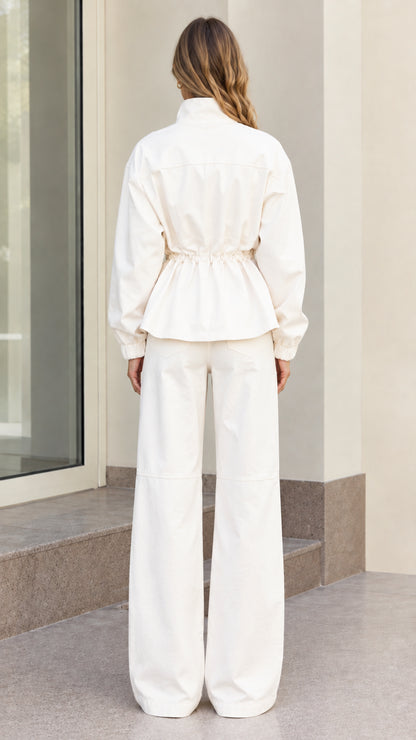 Back view of women's off white utility set showing drawstring waist
