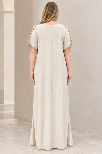Back view of model in elegant champagne full-length kaftan gown
