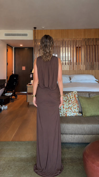 Back view showing the cowl drape design on the brown sleeveless maxi dress