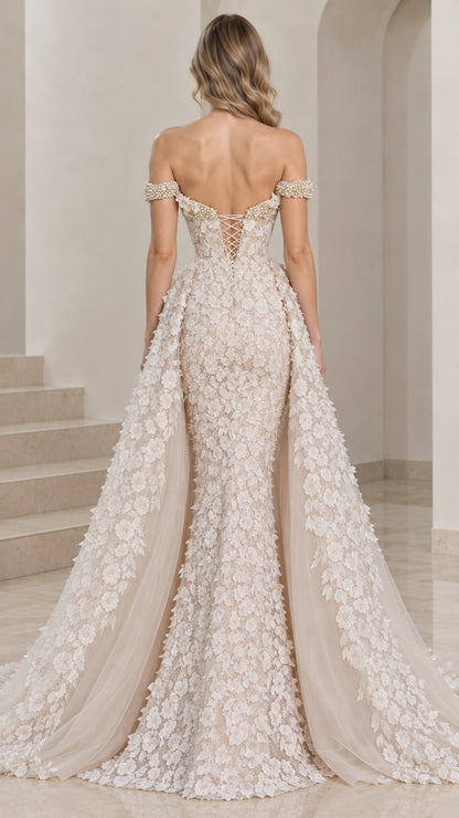 Back view of champagne lace-up corset gown with cascading floral overskirt
