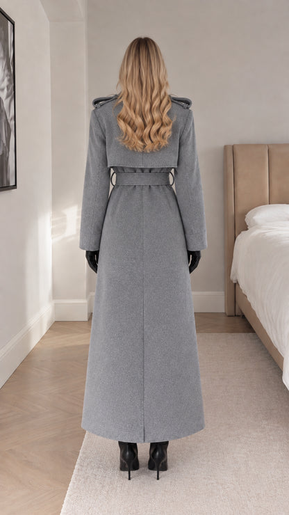 Back view of woman in grey maxi coat showing back vent and belt