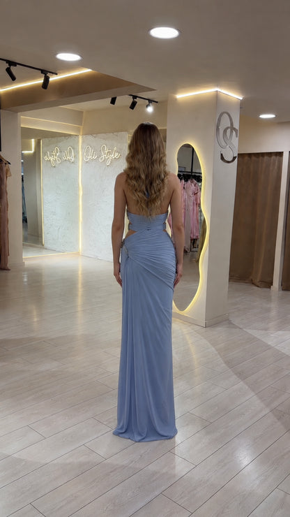 Back view of model in Light Blue open back ruched evening gown