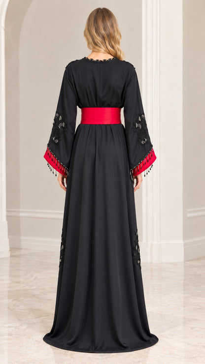 Back view of black floor-length Moroccan kaftan dress with red belt