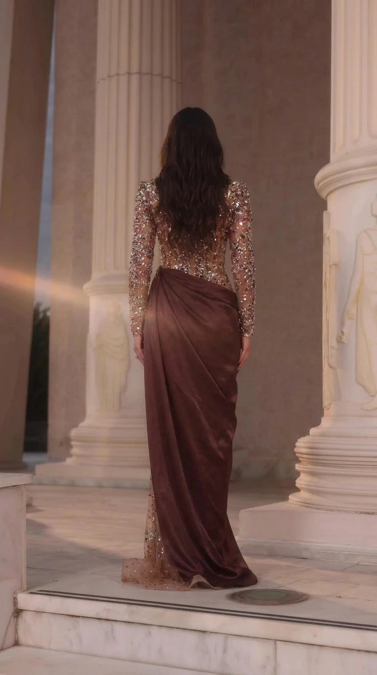 Back view of model wearing Chocolate Brown beaded evening gown with draped satin sash
