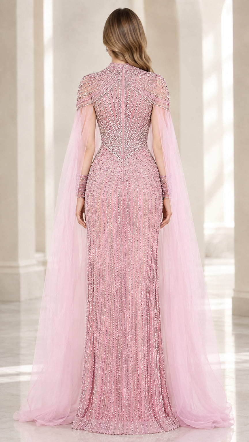 Back view of dusty pink floor-length evening gown with flowing cape