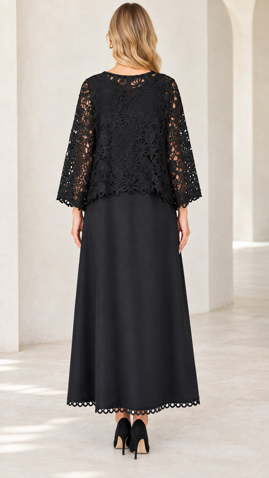 Back view of model in Black floral lace overlay A-line maxi gown