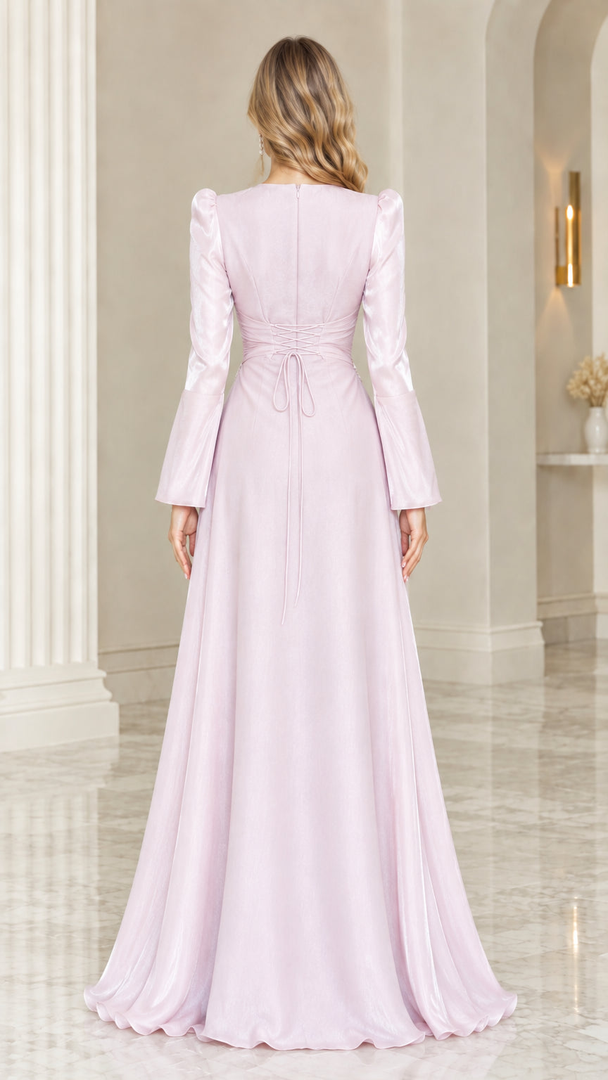 Back view of blush pink formal maxi dress showing waist tie and flowing skirt